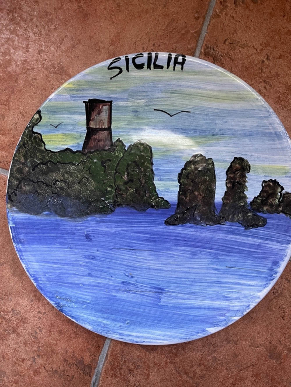 Hand-Painted Sicilia Coastal Ceramic Plate in Blue and Green. Has holes to hang